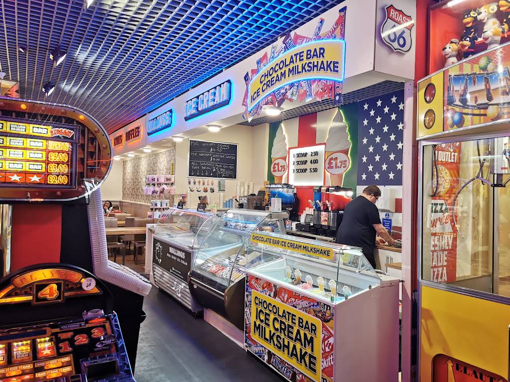 The café’s colourful ice cream and milkshake counter beside the amusement area, photographed in 2022